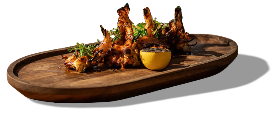 pescados y mariscos a la leña en Taboo Beach club